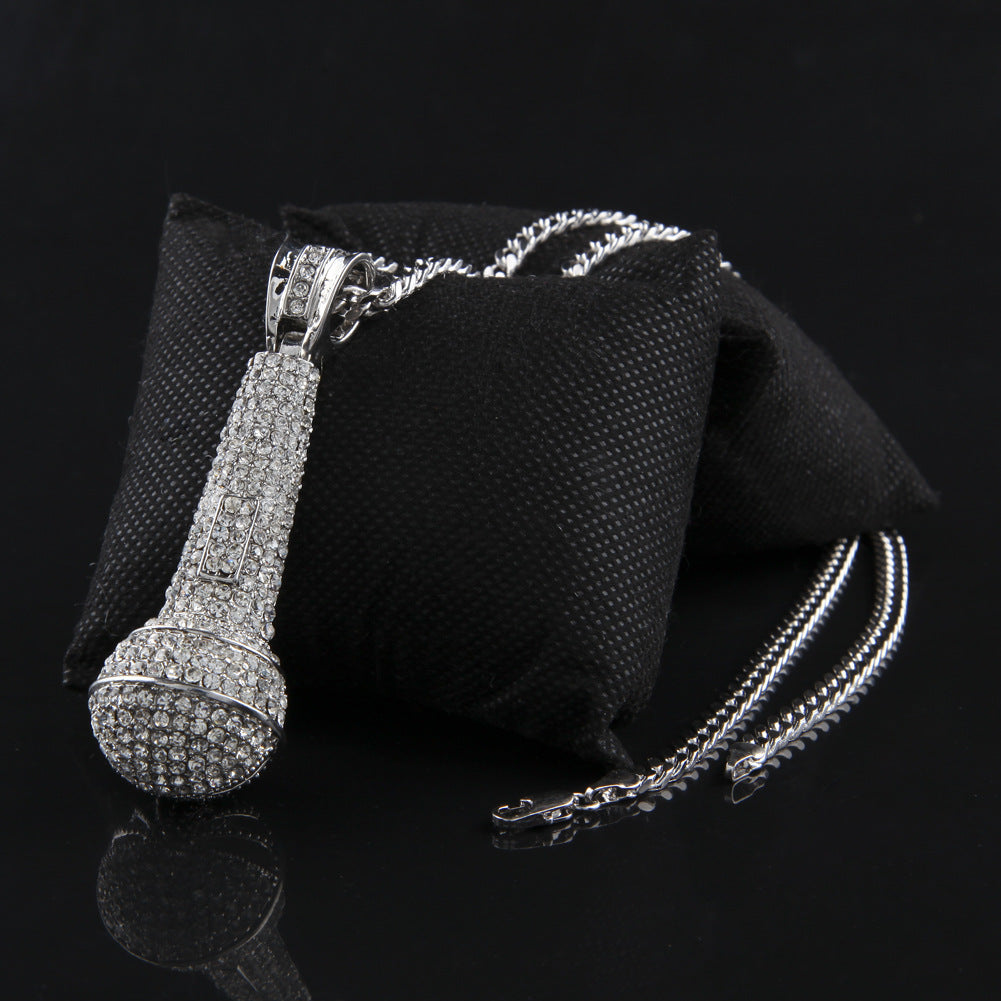Hip-hop diamond-encrusted microphone necklaces. by nowadaysfashion