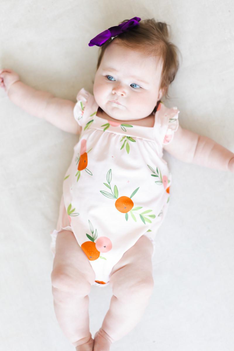 Tangerine Ruffle Cross Back Romper by Mila & Rose ®