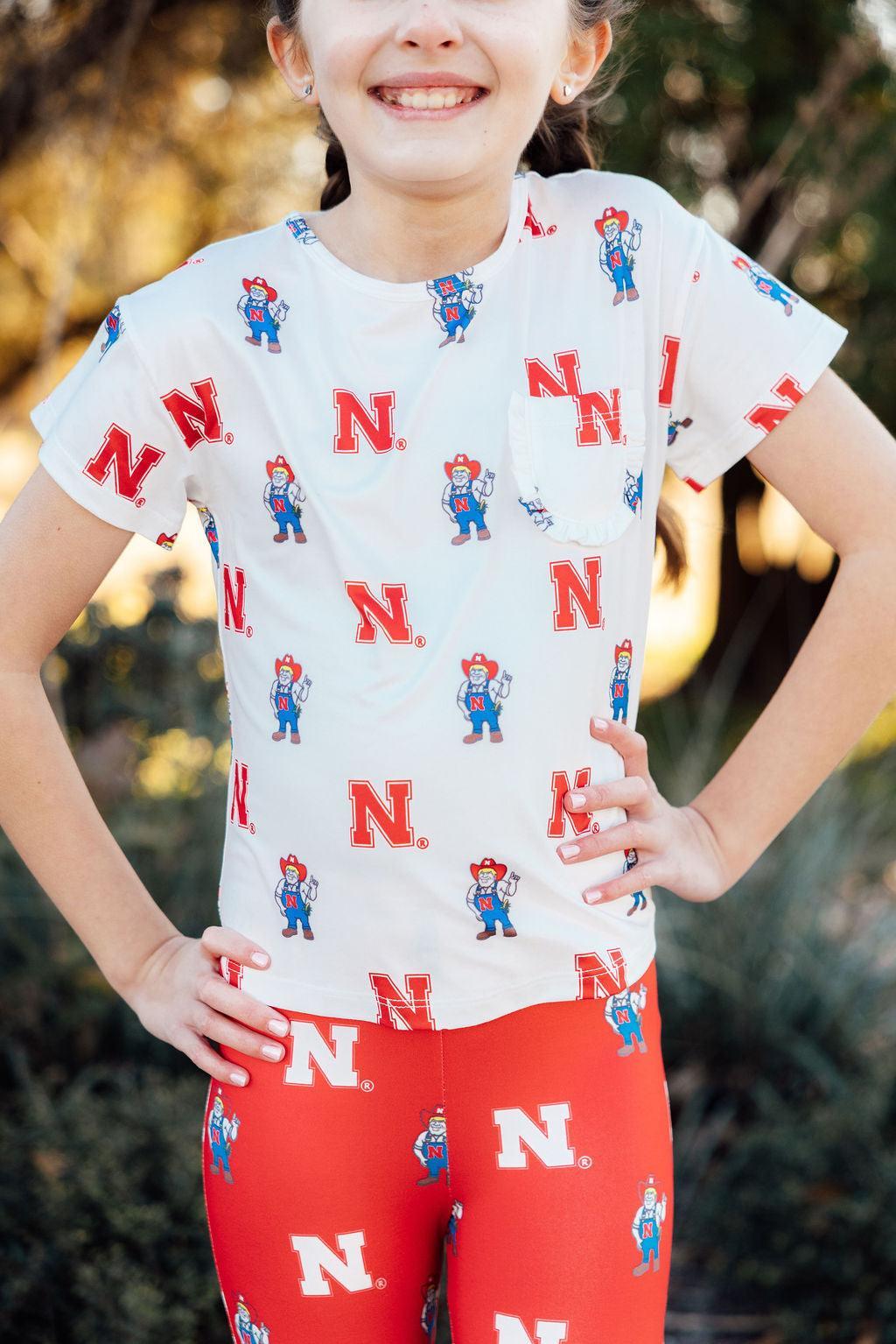 Nebraska White Herbie Husker Ruffle Pocket Tee by Mila & Rose ®