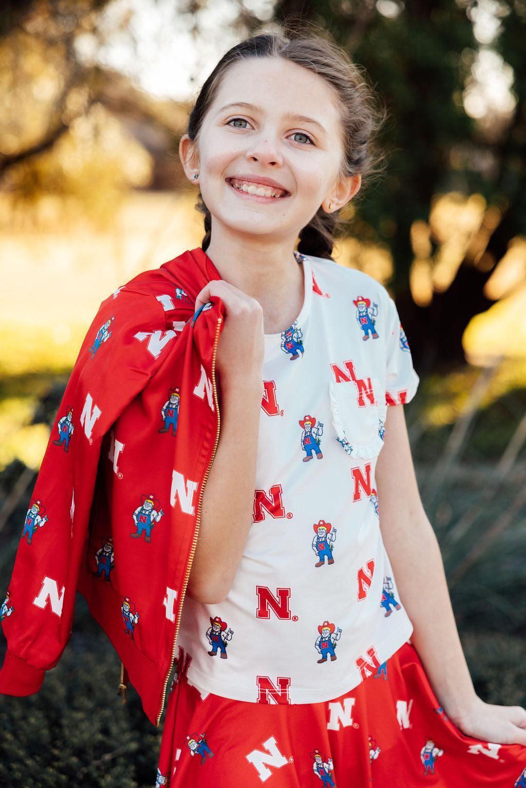 Nebraska White Herbie Husker Ruffle Pocket Tee by Mila & Rose ®