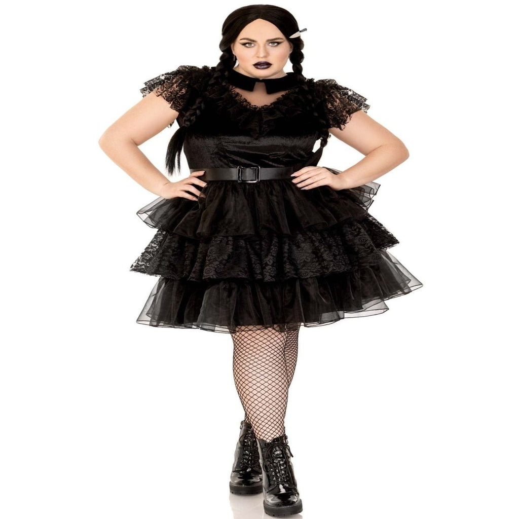 Plus-size model in a black 3-piece Raving Rebel Costume with lace and velvet dress, belt, and fishnet tights.