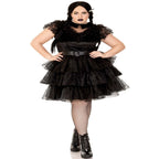 Plus-size model in a black 3-piece Raving Rebel Costume with lace and velvet dress, belt, and fishnet tights.