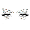 Celeste glow-in-the-dark face jewels sticker around the eyes with iridescent star accents.
