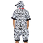Back view of a man in a black-and-white spotted Dalmatian dog costume jumpsuit with hood and black cuffs.