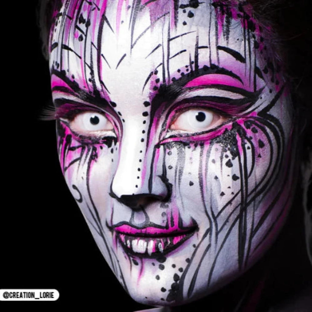 Person wearing PRIMAL Zombie I colored contact lenses with white-pink zombie makeup.
