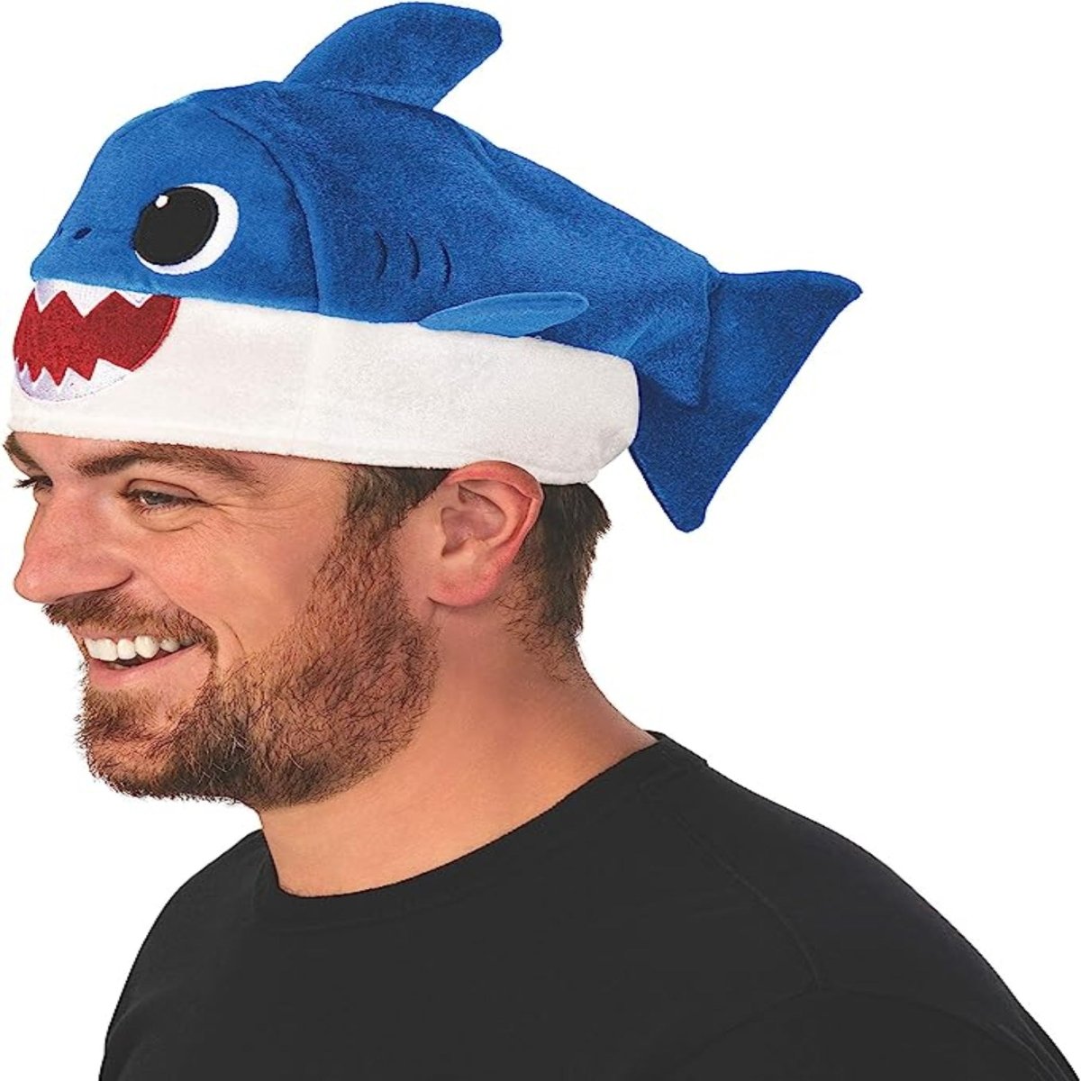 Rubie's Baby Shark Hat with Original Song Sound Chip, blue plush shark hat with white belly worn by man.